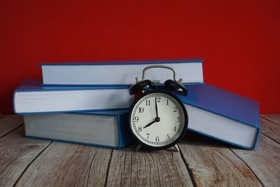 Close-up of clock on table