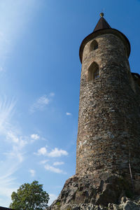 Low angle view of clock tower against sky