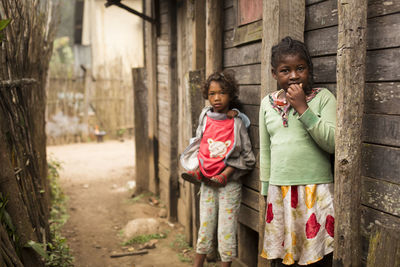 Portrait of a smiling girl standing outdoors