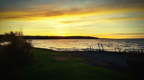 Scenic view of sea against sky during sunset