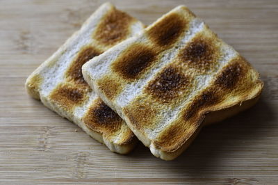 High angle view of bread on cutting board