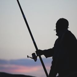 Low angle view of people against sky