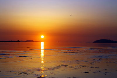 Scenic view of sea at sunset