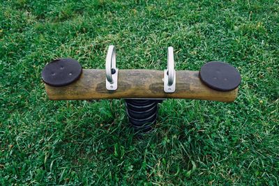 Seesaw in the playground, old wooden seesaw