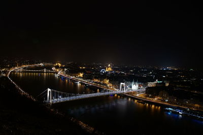 High angle view of illuminated bridge in city at night