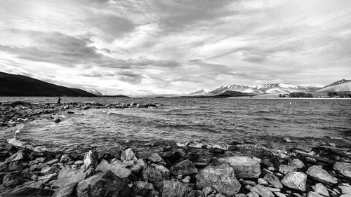 Scenic view of sea against cloudy sky