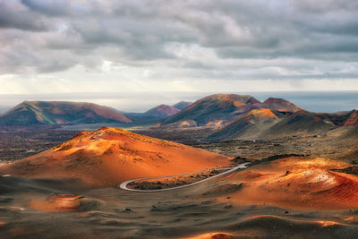 Scenic view of landscape and mountains against sky