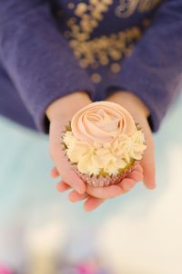 Close-up of hand holding rose bouquet