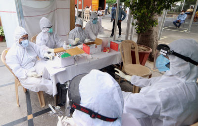 High angle view of people working on street