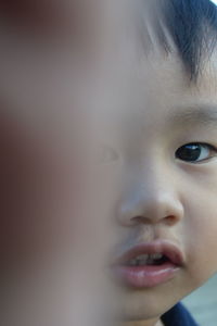 Portrait of cute baby girl looking away