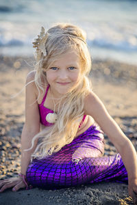 Portrait of a smiling young woman on beach