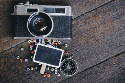 Camera with papers and potted plant