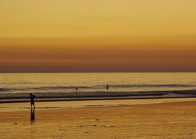 Scenic view of sea at sunset