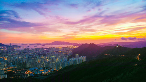 High angle view of buildings against sky during sunset