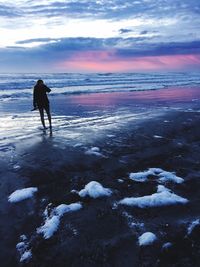 Scenic view of sea against sky during winter