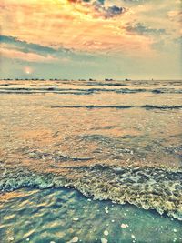 Scenic view of beach against sky during sunset