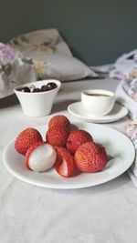 Close-up of strawberries in plate on table