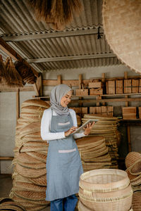 Rear view of woman standing at market