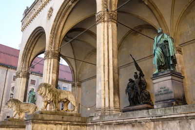 Stone lions in front of the historic building feldherrenhalle in munich