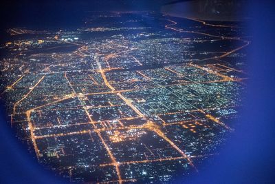 Aerial view of illuminated city at night