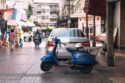 Bicycles on street by buildings in city