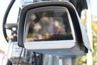 Reflection of camera on side-view mirror of car