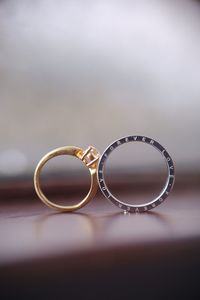 Close-up of wedding rings on table