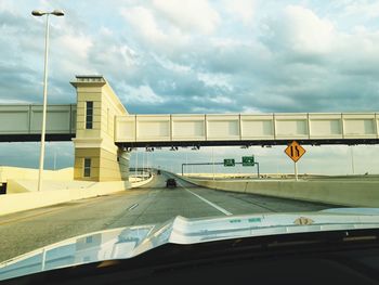 Road against cloudy sky