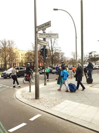 People sitting on road