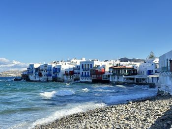Scenic view of sea against clear blue sky