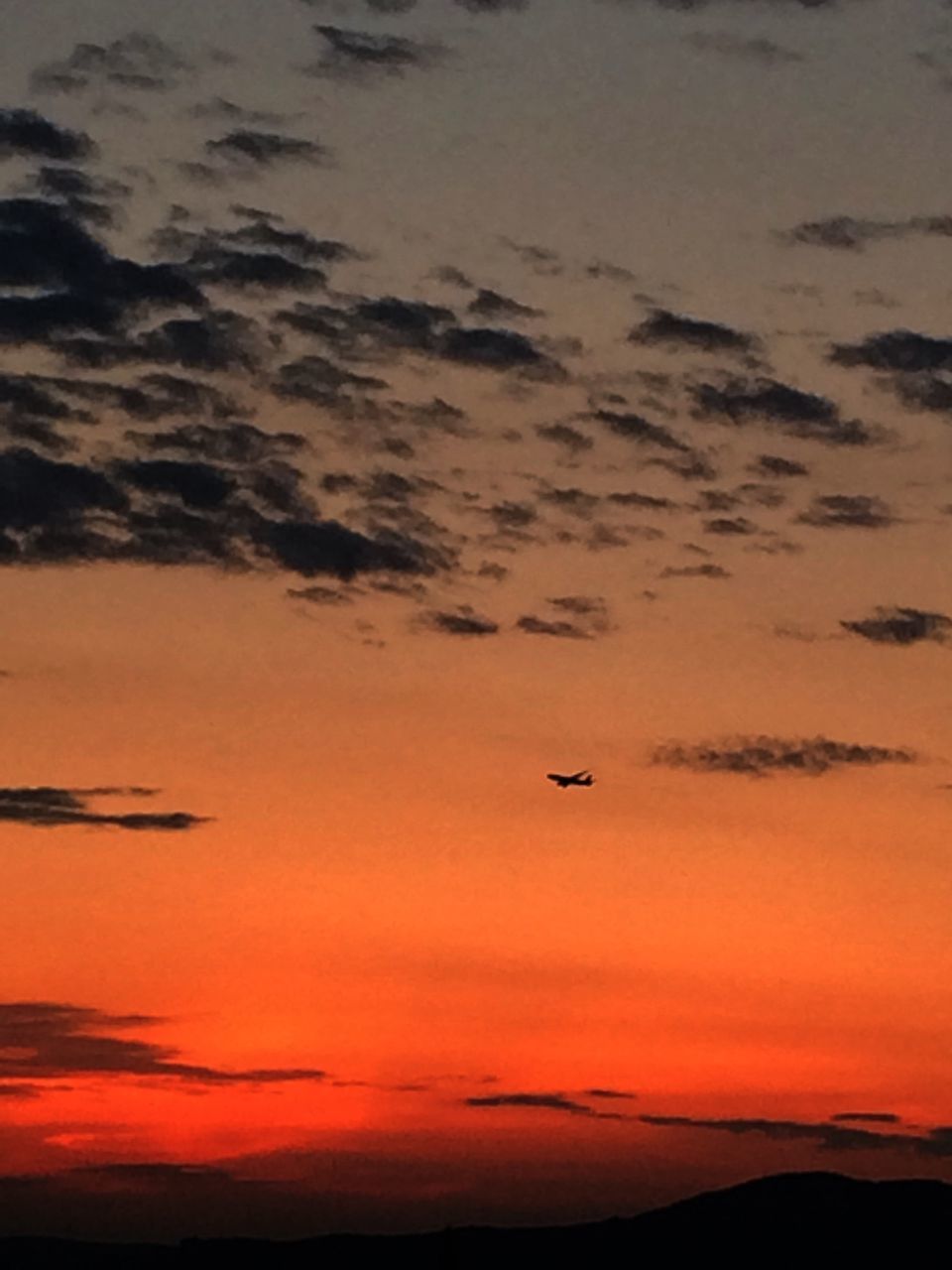 sunset, orange color, scenics, silhouette, beauty in nature, tranquil scene, tranquility, sky, nature, idyllic, flying, transportation, landscape, airplane, mountain, cloud - sky, travel, mode of transport, outdoors, majestic