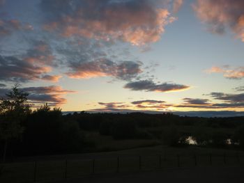 Scenic view of silhouette landscape against sky during sunset