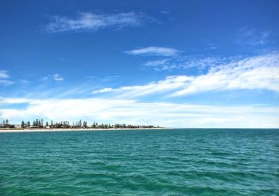 Scenic view of sea against blue sky