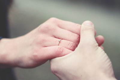 Close-up of hand holding hands