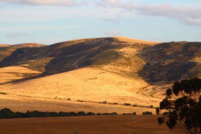 Scenic view of landscape and mountains against sky