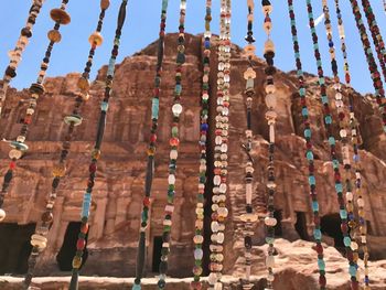 Low angle view of temple hanging against buildings