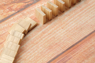 High angle view of toy blocks arranged on wooden table