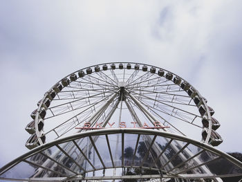 Low angle view of ferris wheel against sky