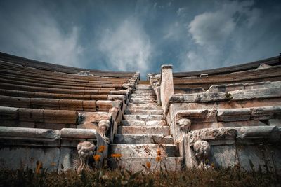 Old ruins of temple against cloudy sky