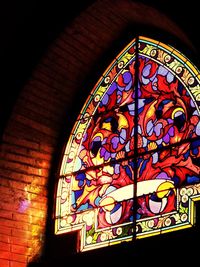 Low angle view of stained glass window