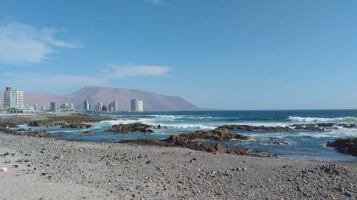 Scenic view of sea against blue sky