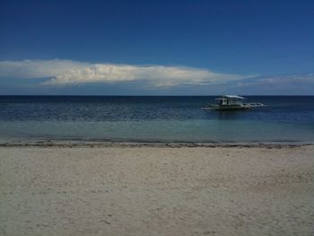 Scenic view of calm sea against sky