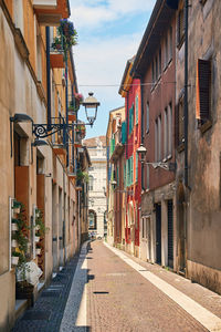 Narrow street amidst buildings in town