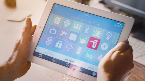 Close-up of hand holding mobile phone