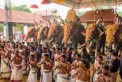 Group of people at market stall