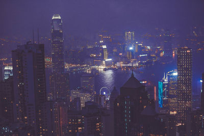Aerial view of city lit up at night