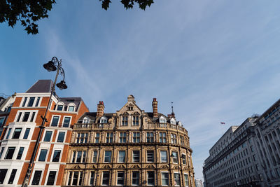 Old residential buildings in the city of london against blue sky.