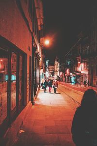 People on street at night