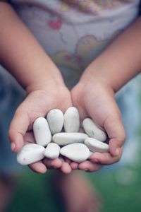 Close-up of hand holding boy