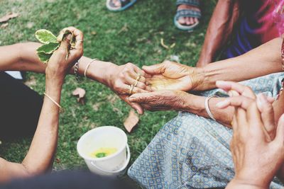 High angle view of people holding hands